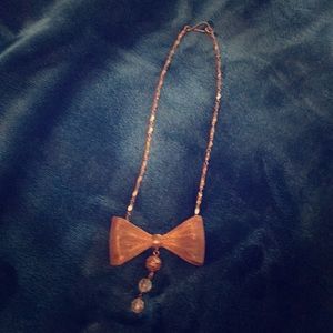 Handmade brass bow necklace